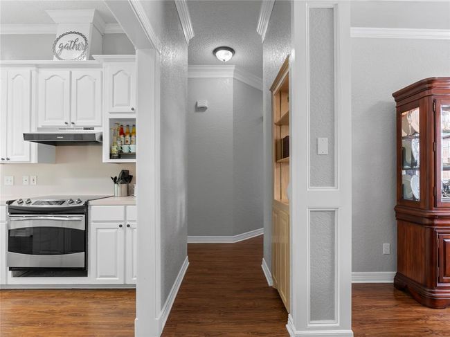 Hallway to kitchen, main living area and 3 other bedrooms and full bath | Image 22