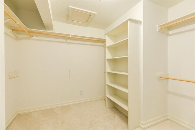 Step into the large primary closet offering ample storage and organization space | Image 25