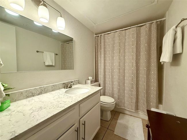 Full bath with tile patterned floors, toilet, and vanity | Image 15