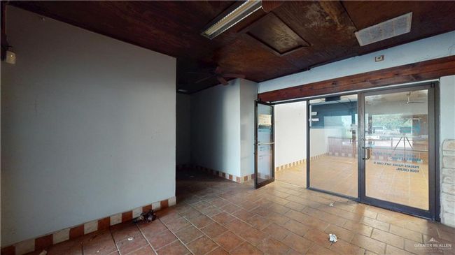 Unfurnished room featuring baseboards and wooden ceiling | Image 45