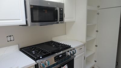 Upgraded oven range and roomy pantry cabinet. | Image 3