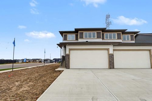 303 Dawson Dock Way, Home with 3 bedrooms, 3 bathrooms and 4 parking in Chestermere AB | Card Image