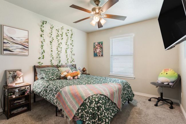 Bedroom featuring carpet floors and ceiling fan | Image 22