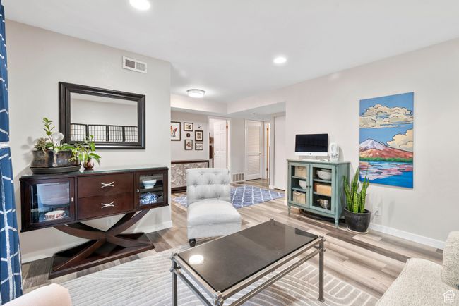 Living room with wood finished floors and recessed lighting | Image 11