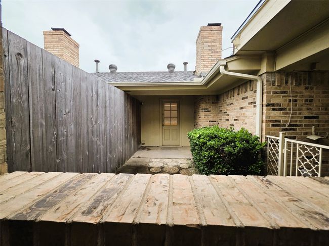 Unfurnished office with built in desk, light wood-style floors, and baseboards | Image 27