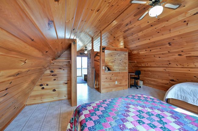 There is storage space for clothing or linens and ceiling fans in both bedrooms. | Image 78