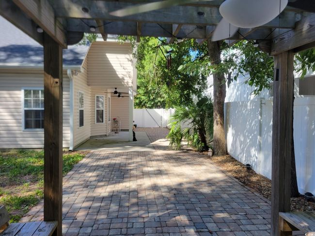 Fenced backyard featuring a patio | Image 32