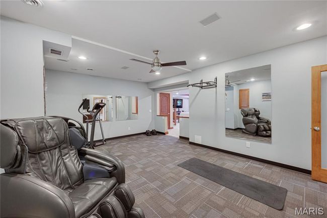 Workout area with carpet, a ceiling fan, and recessed lighting | Image 55