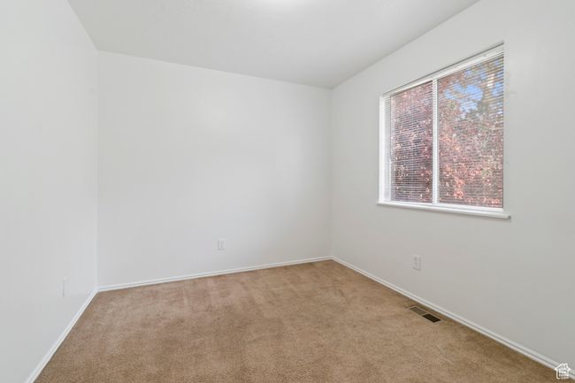 Empty room with light colored carpet and baseboards | Image 21