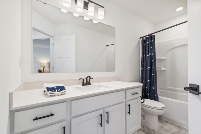(Photo of a decorated model, actual homes finishes will vary) Spacious full secondary bath provides plenty of space for everyone to get ready during those busy mornings. | Image 20