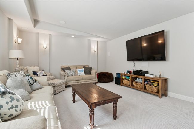 Living room with baseboards and light colored carpet | Image 16