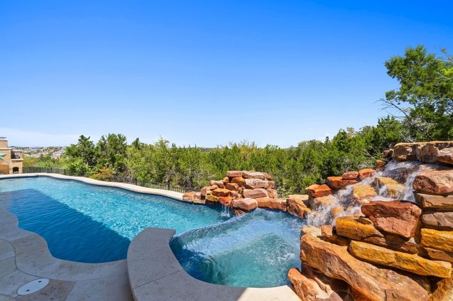 Or indulge in the incredible pool and spa with rock wall water feature. | Image 29