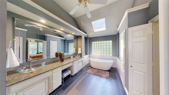 Primary Bath - heated wood-look tile, skylight, double vanity & soaking tub | Image 22