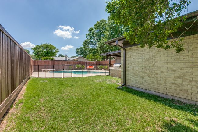 View of fenced backyard | Image 37