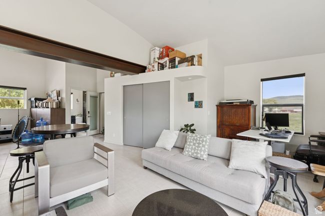 Living room featuring high vaulted ceiling | Image 35