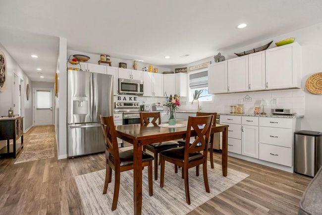 Dining area featuring baseboards, recessed lighting, and light wood-style flooring | Image 11