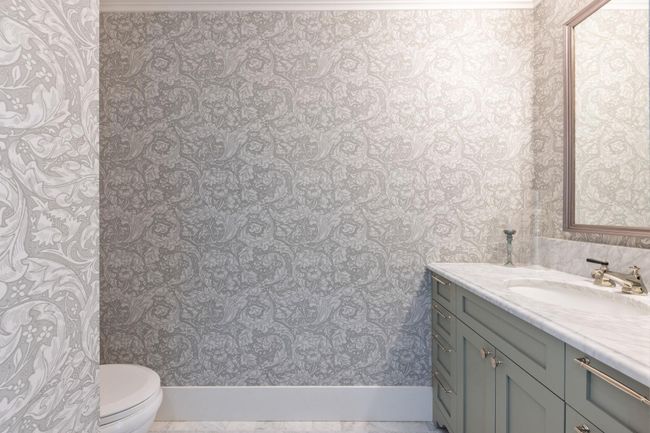 Bathroom featuring wallpapered walls, baseboards, vanity, and toilet | Image 18