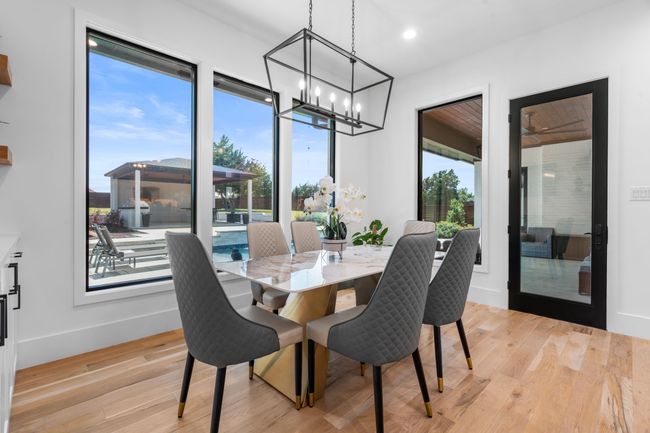 Dining space with a chandelier, light wood-style floors, baseboards, and recessed lighting | Image 12