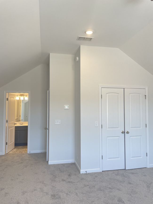Closet in bonus room and full bathroom. There is also a door at the top of the stairs to close off this space if need be. | Image 14