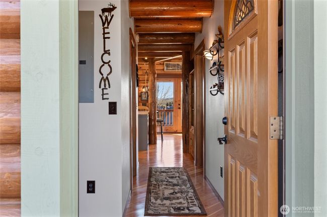 Upon entering the house, you will find the hallway where the downstairs bedroom and bathroom are located of off. At the end of this hallway.....paradise! | Image 6