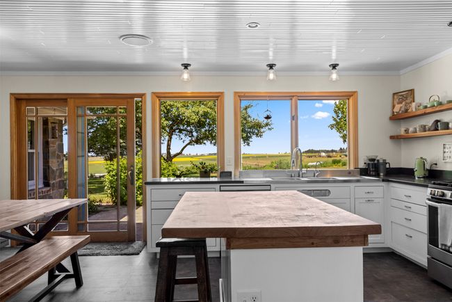 Kitchen with an abundance of windows to enjoy the views! | Image 12