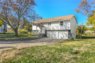 View of front facade with a front lawn and a garage, new roof installed since photos have been taken | Image 1