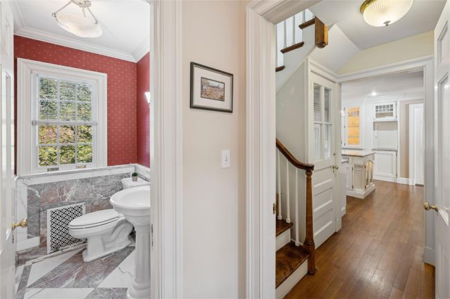 View if the secondary stairs off the kitchen to the second level | Image 16