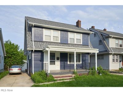 View of front of property featuring a porch and a garage | Image 2