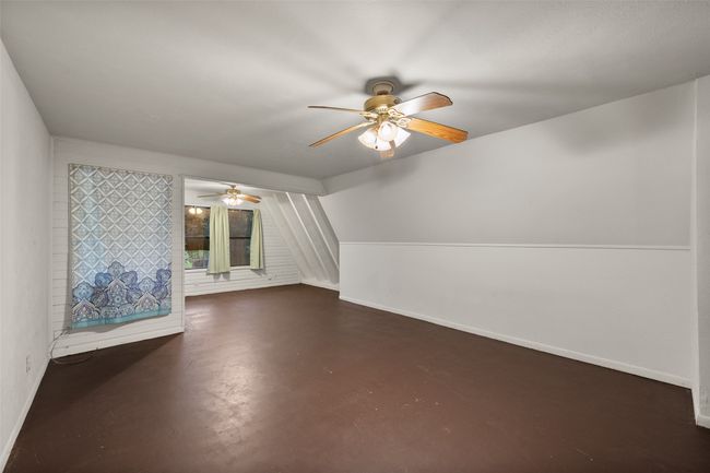 Additional living space featuring painted concrete flooring | Image 17