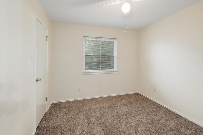 Spare room with carpet floors, ceiling fan, and baseboards | Image 20