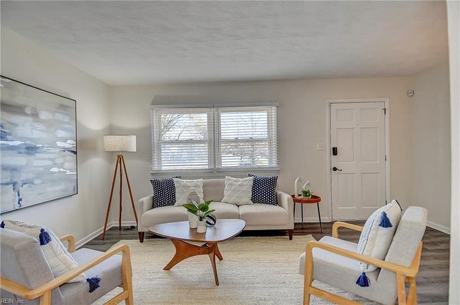 nice Living room space with LVT flooring | Image 11