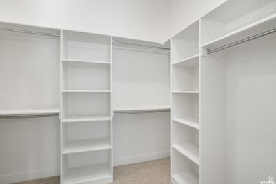 Walk in closet with light colored carpet | Image 3