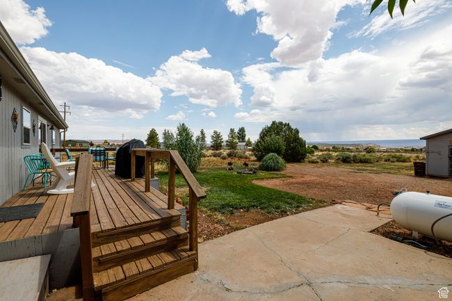 View of yard with a wooden deck and a patio | Image 28