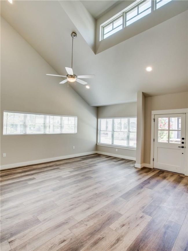 Vaulted ceiling of living room provides plenty of light. | Image 4