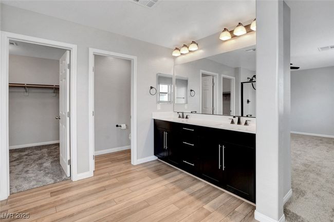 Full bath with baseboards, toilet, wood finished floors, and a spacious closet | Image 46
