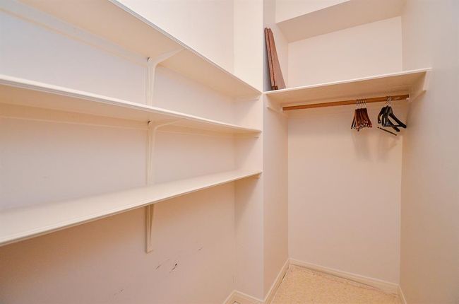 The secondary bedroom has a walk-in closet. | Image 19
