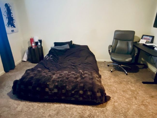 Carpeted bedroom with baseboards | Image 8