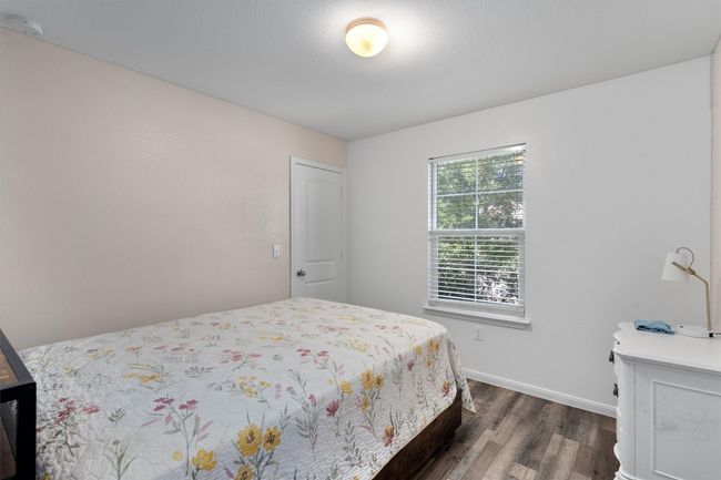 Bedroom featuring dark wood-style flooring and baseboards | Image 20