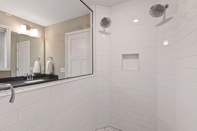 Custom tiled shower with dual heads | Image 25