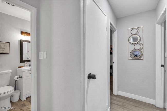 Bathroom with wood finished floors, toilet, vanity, and baseboards | Image 27