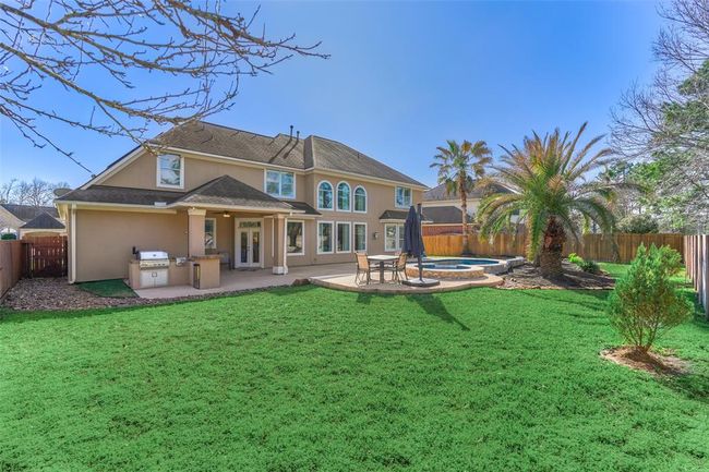 Experience luxury in your own backyard with a sundeck and outdoor kitchen, perfect for grilling and entertaining. | Image 31