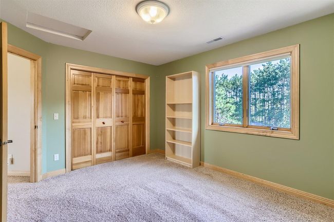 Bedroom #2 on the 2nd floor is generously sized and overlooks the backyard. | Image 19