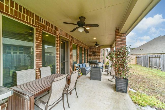 This covered patio provides a great space for entertaining, outdoor grilling and /or simply relaxing and unwinding. | Image 8
