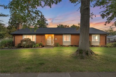 Ranch-style home featuring a lawn | Image 2