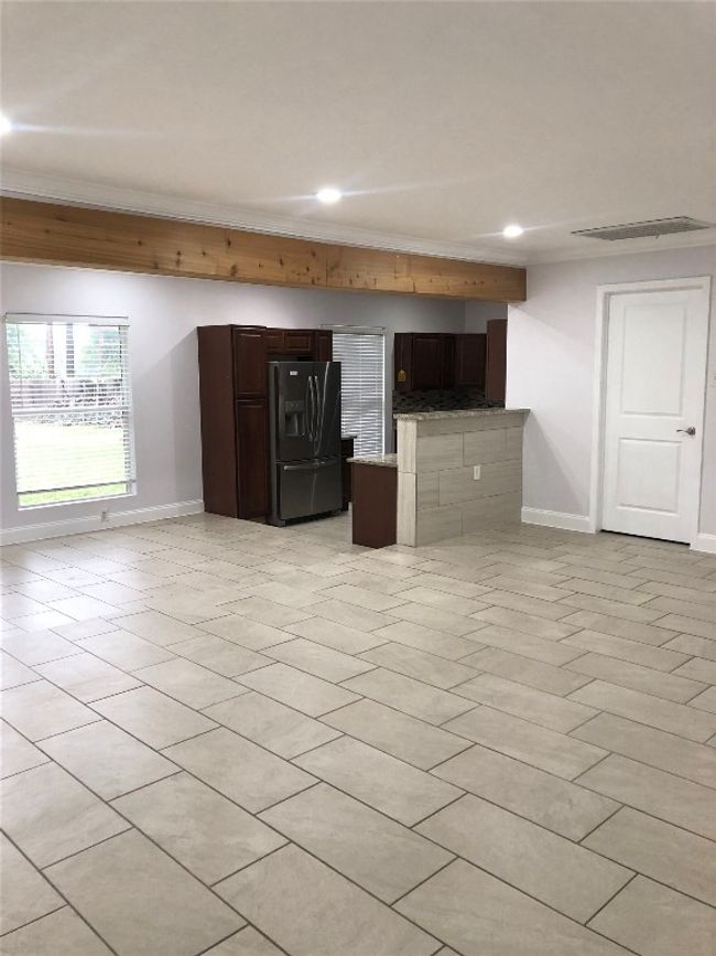 Unfurnished living room with recessed lighting and light tile patterned floors | Image 7