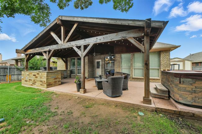 Back of property with a patio area, ceiling fan, brick siding, and a gazebo | Image 6