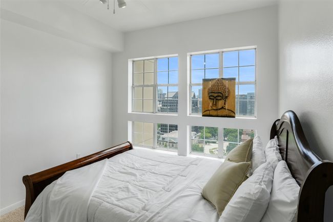 Bedroom with a view of city | Image 24