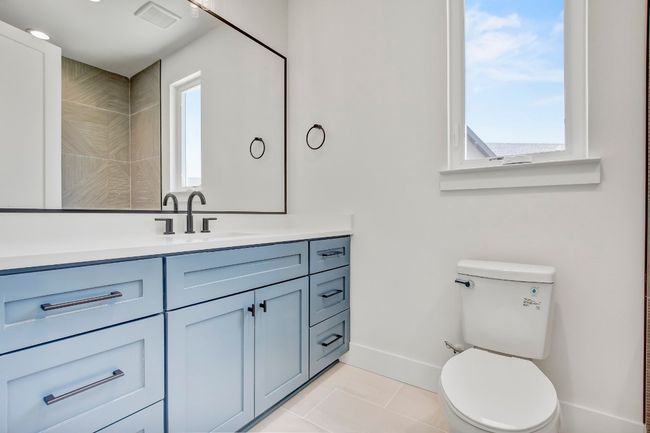 Bathroom with vanity, healthy amount of natural light, toilet, and tile patterned flooring | Image 28