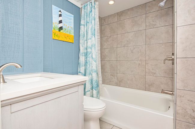 Bathroom featuring vanity, shower / bath combo, tile patterned flooring, and recessed lighting | Image 18