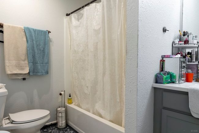 Full bath with toilet and shower / bathtub combination with curtain | Image 9